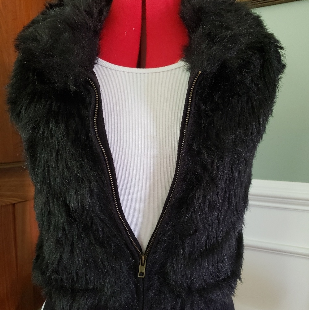 Black fur vest.